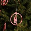 Pink Glow in the Dark Pole Dance Ornament hanging on a festive Christmas tree. Poledance Holiday Decoration